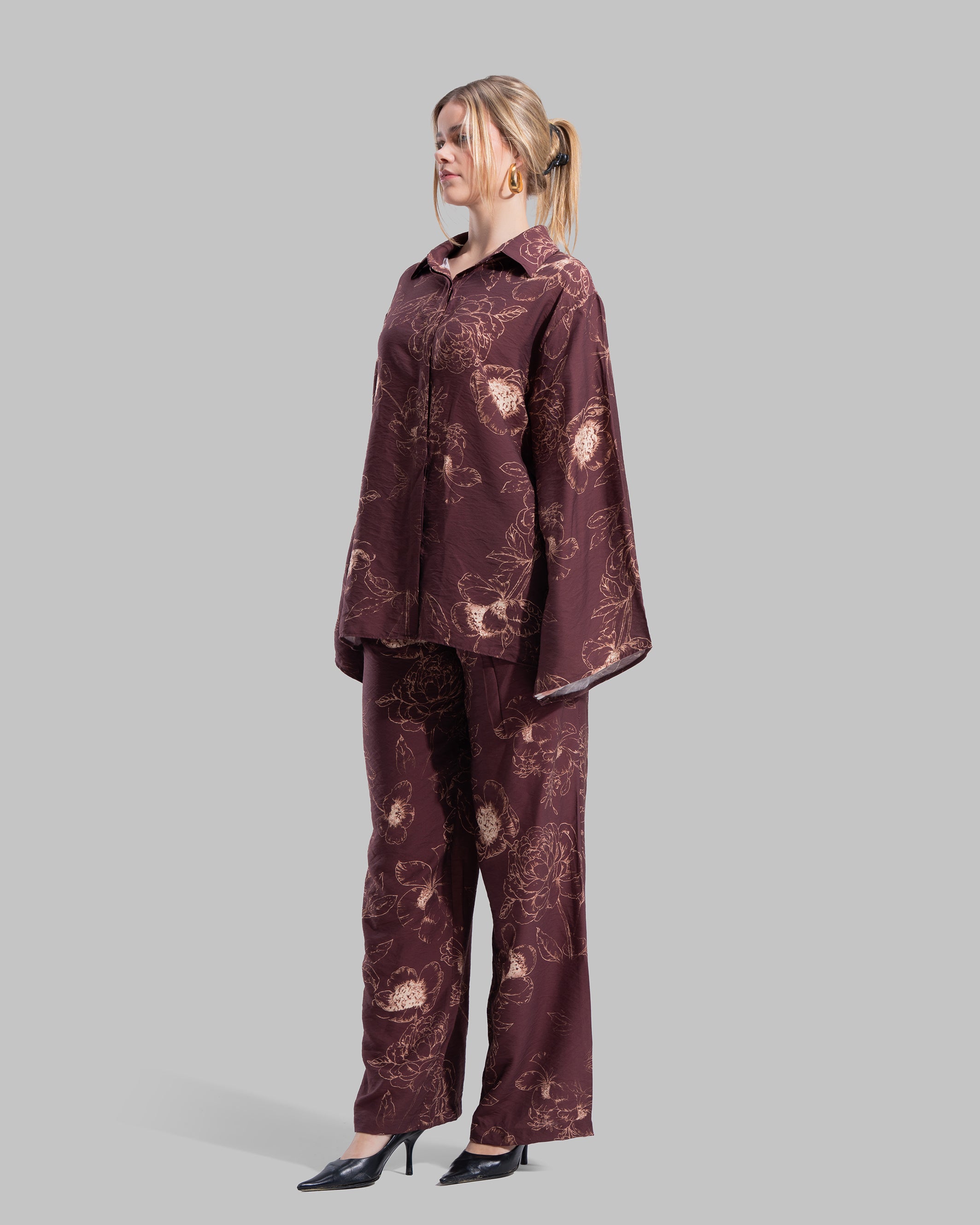 Oversized floral print blouse with a classic collar and long sleeves.