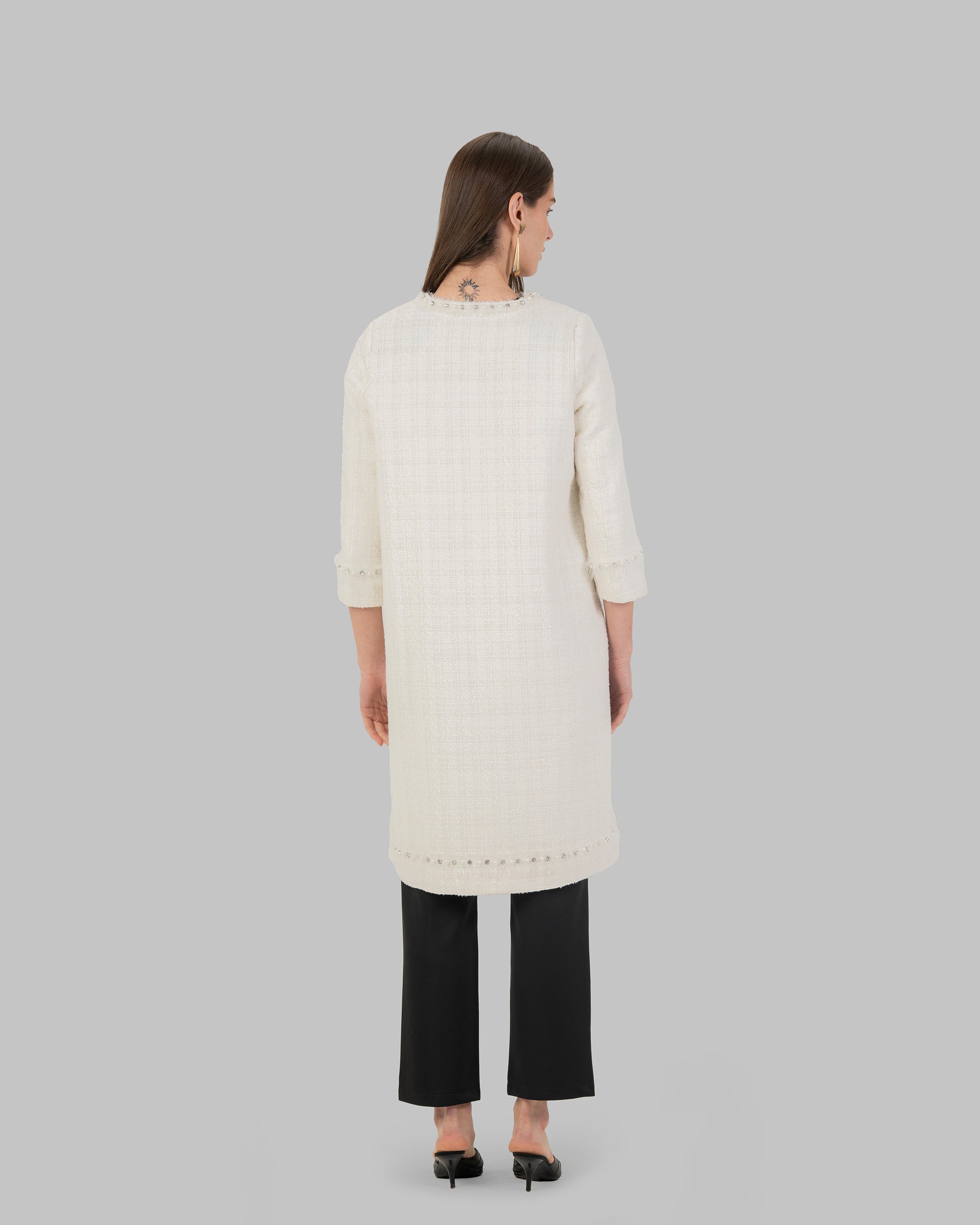 Long, off white coat made of textured tweed fabric
