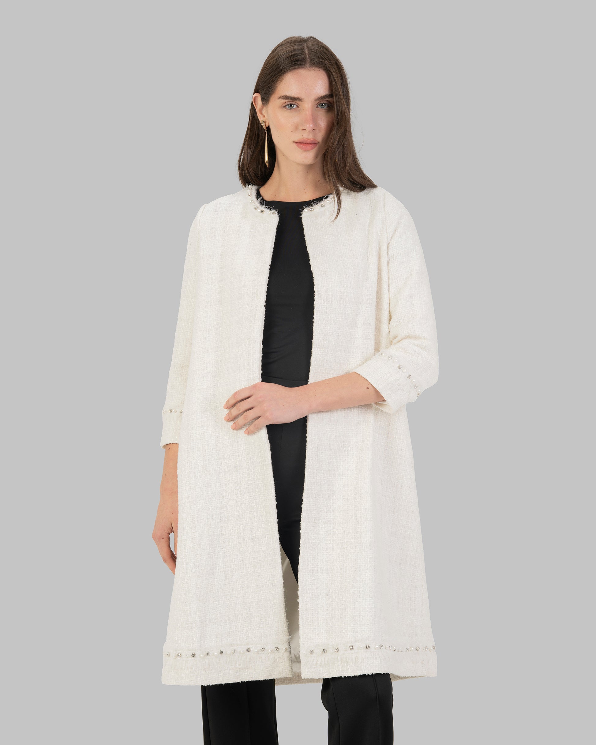 Long, off white coat made of textured tweed fabric