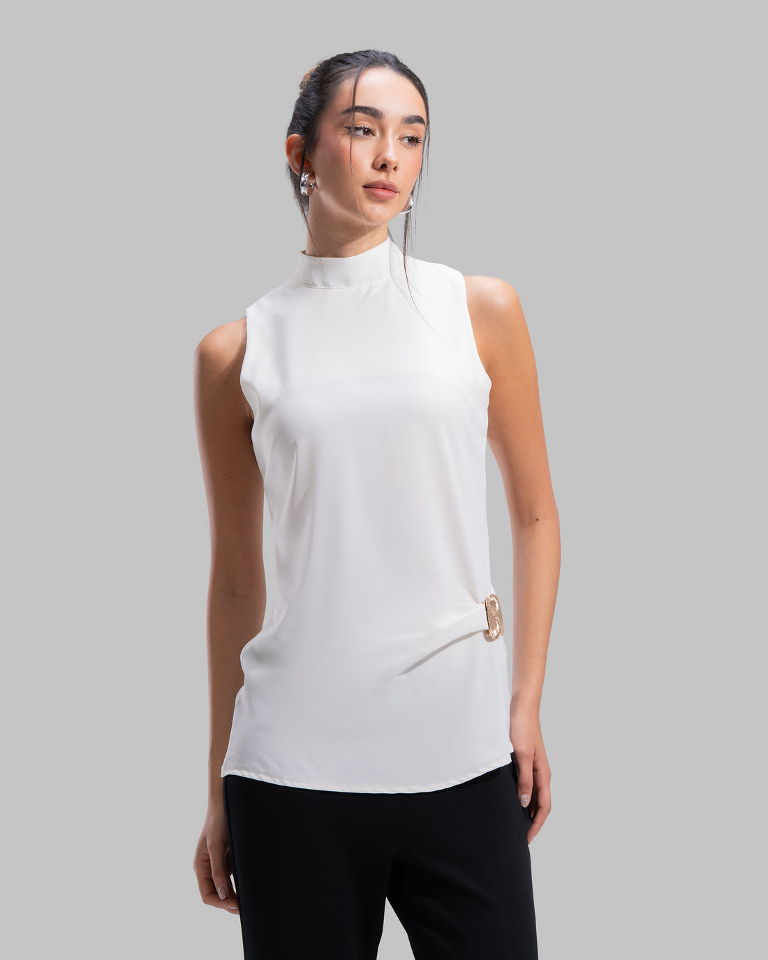 Sleeveless high-neck top with gathered detail and a metallic side buckle.