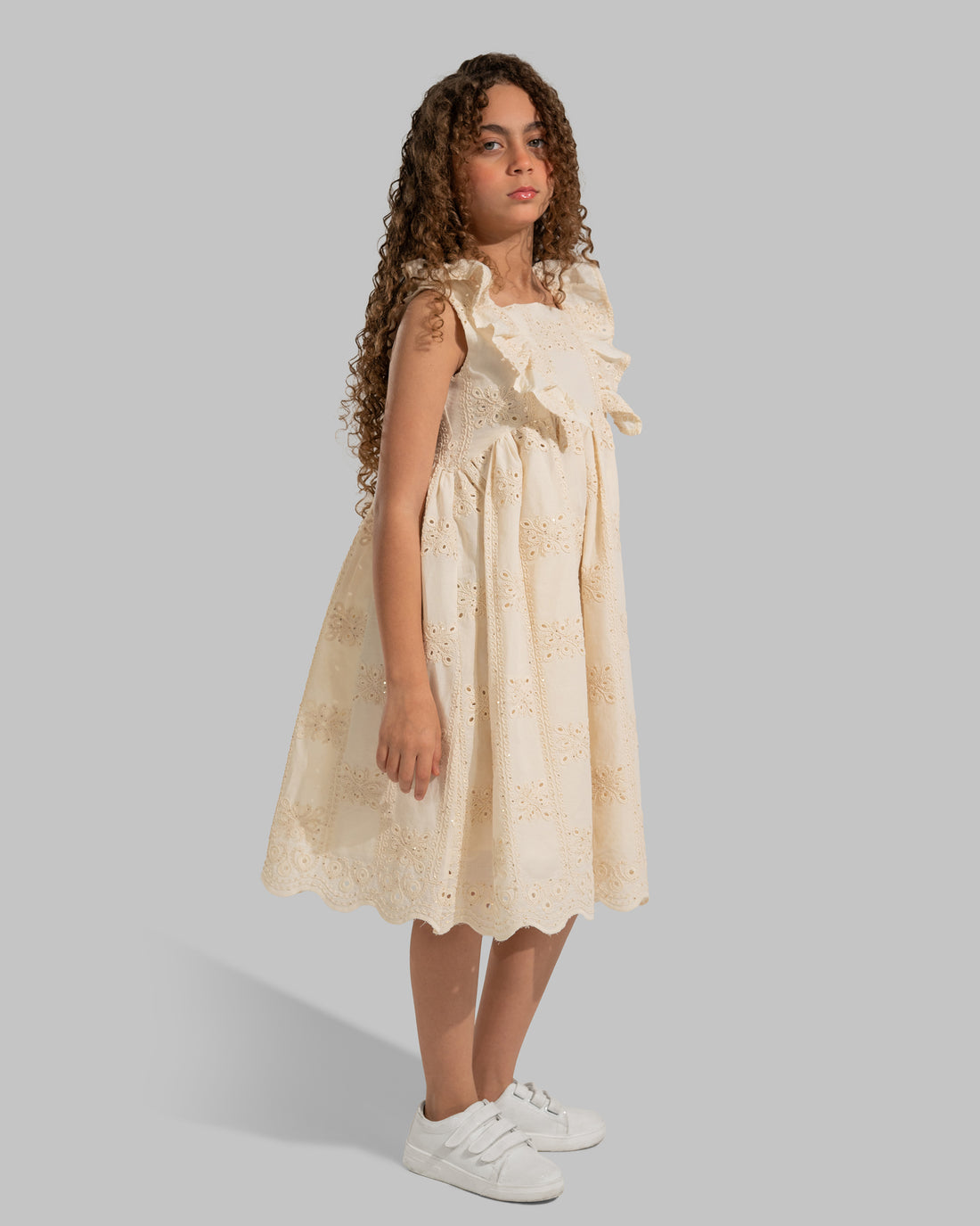 Embroidered sleeveless dress with a square neckline and ruffle details on the straps