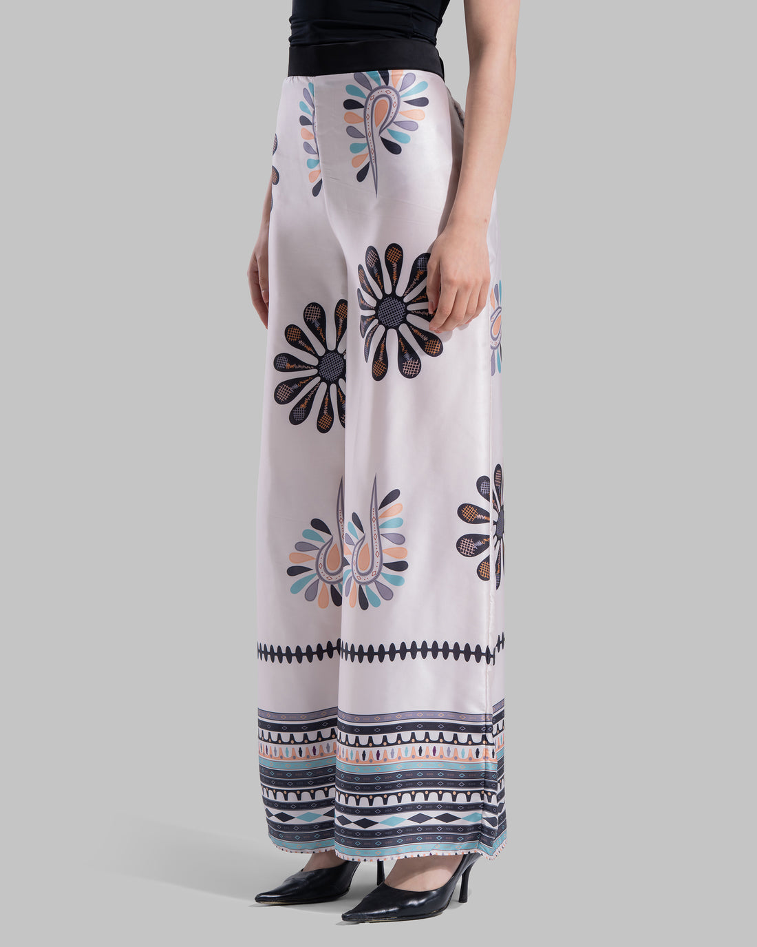High-waist wide-leg pants with elastic waistband and Boho Sunburst graphic print.