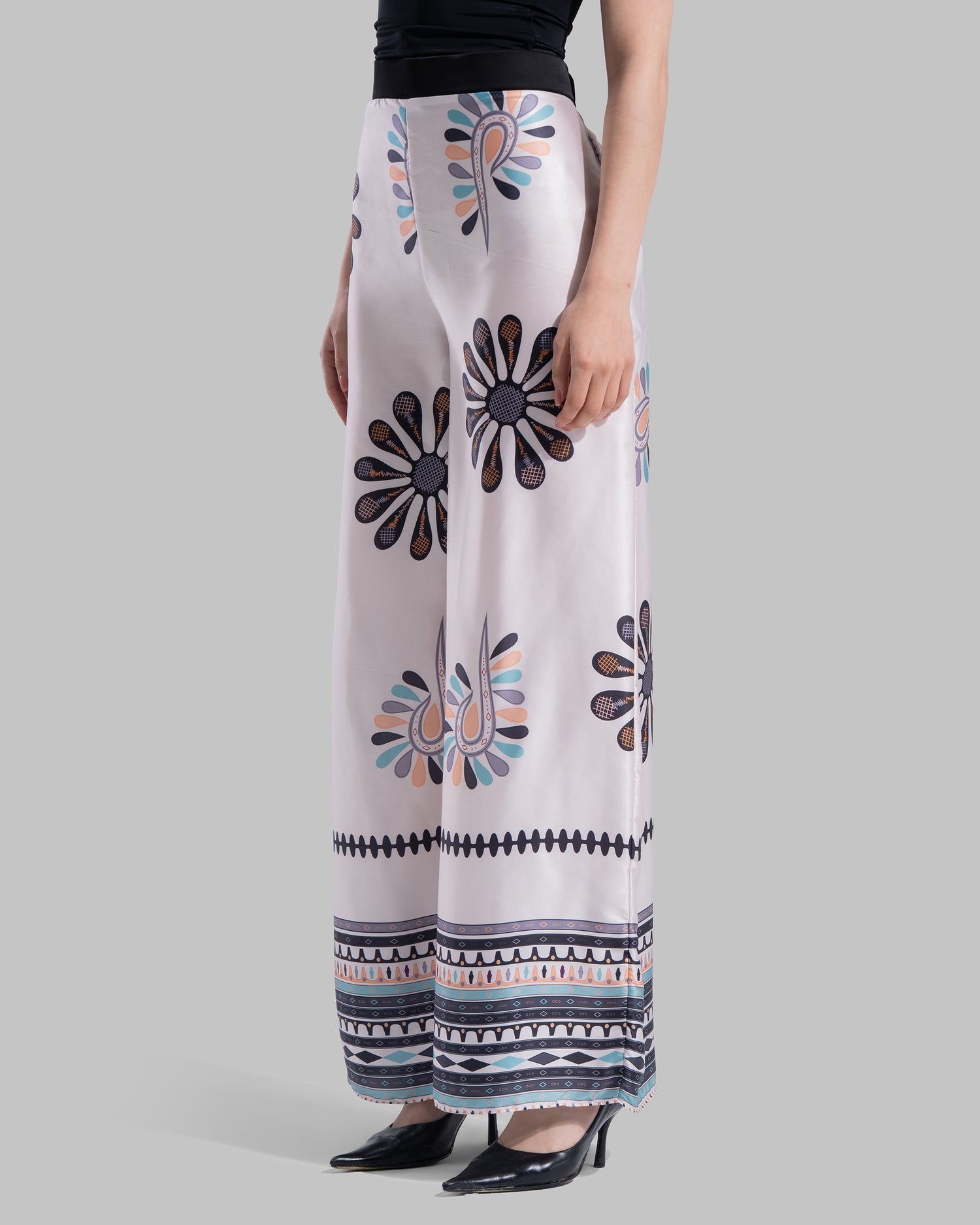 High-waist wide-leg pants with elastic waistband and Boho Sunburst graphic print.