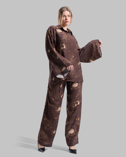 Oversized floral print blouse with a classic collar and long sleeves.