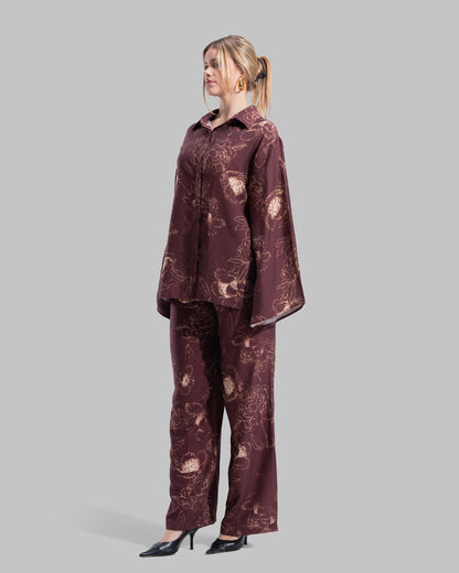 Oversized floral print blouse with a classic collar and long sleeves.