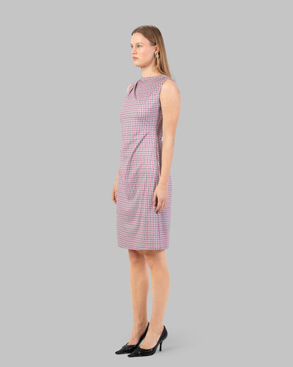 fitted dress with a pink and black houndstooth pattern.