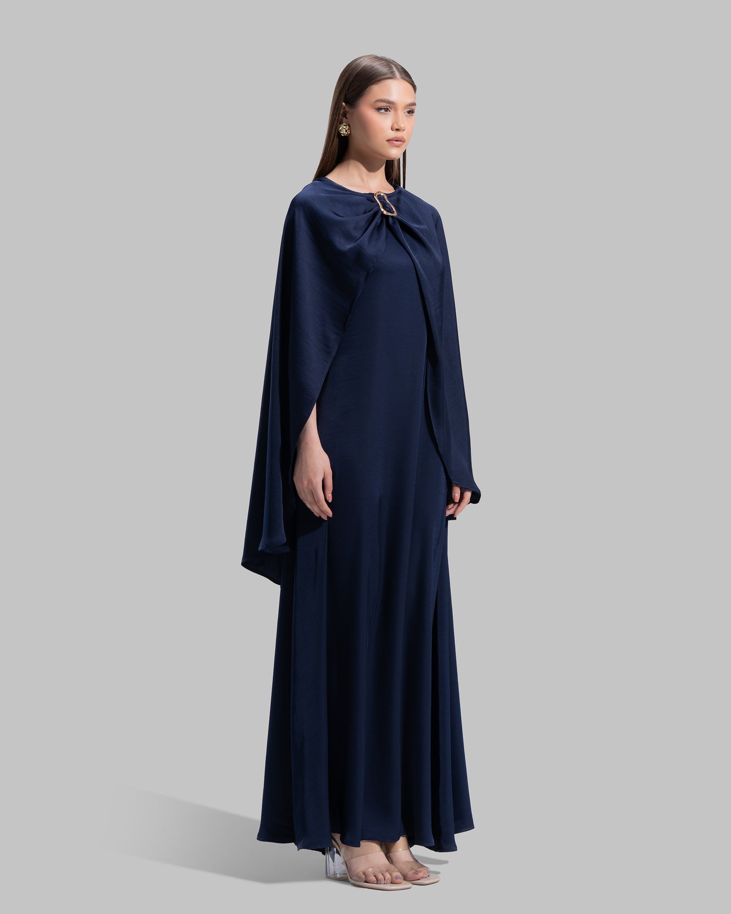 Long dress made of a flowing satin-finish fabric.