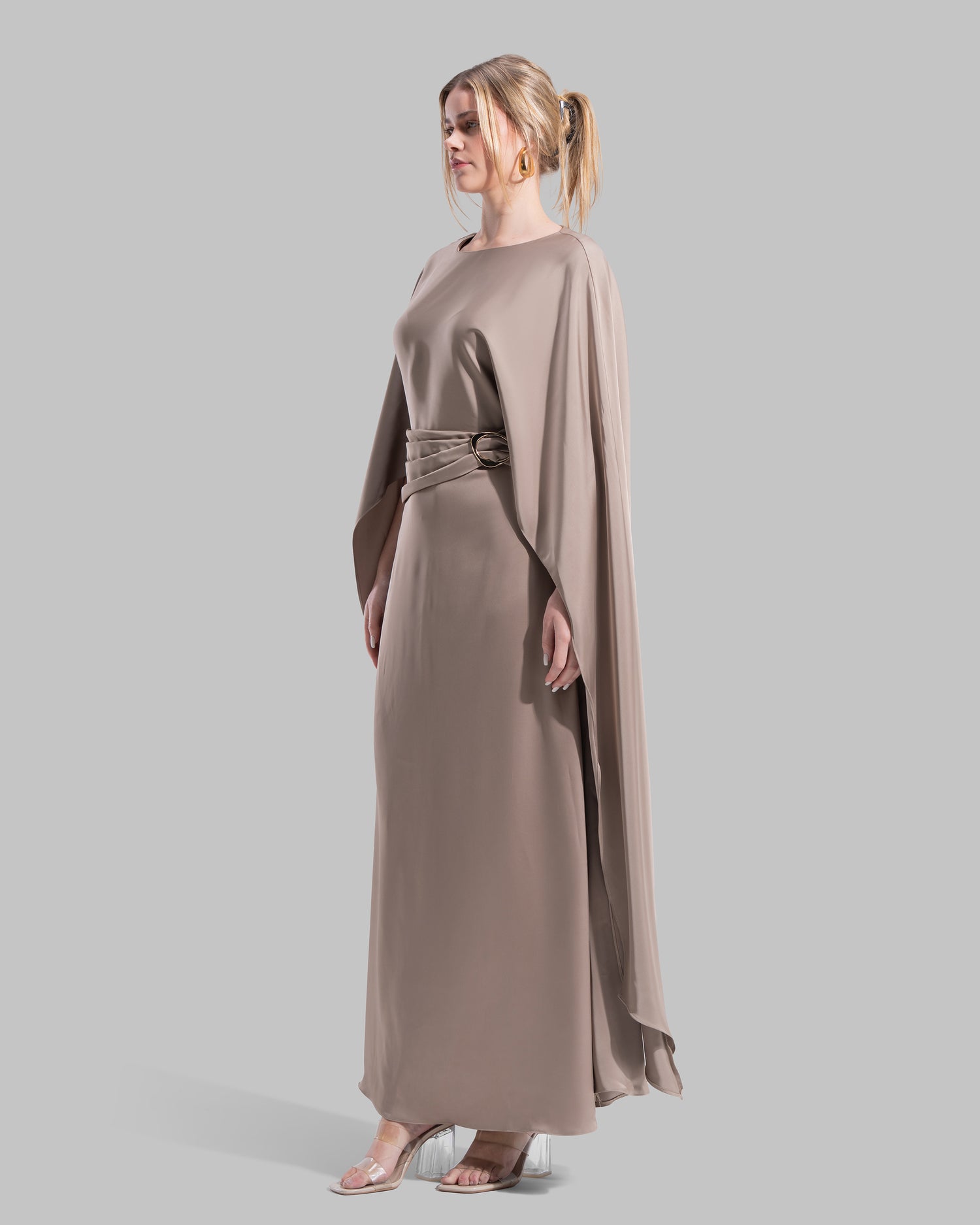 An elegant satin gown of sweeping length