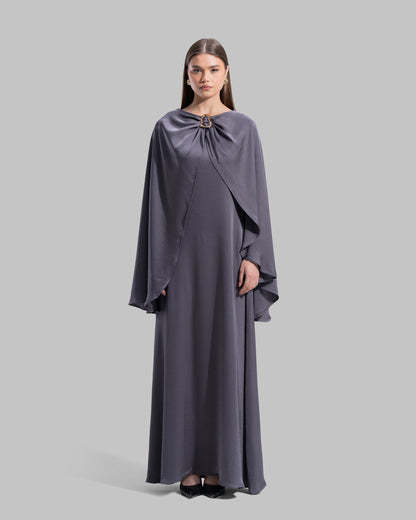 Long dress made of a flowing satin-finish fabric.