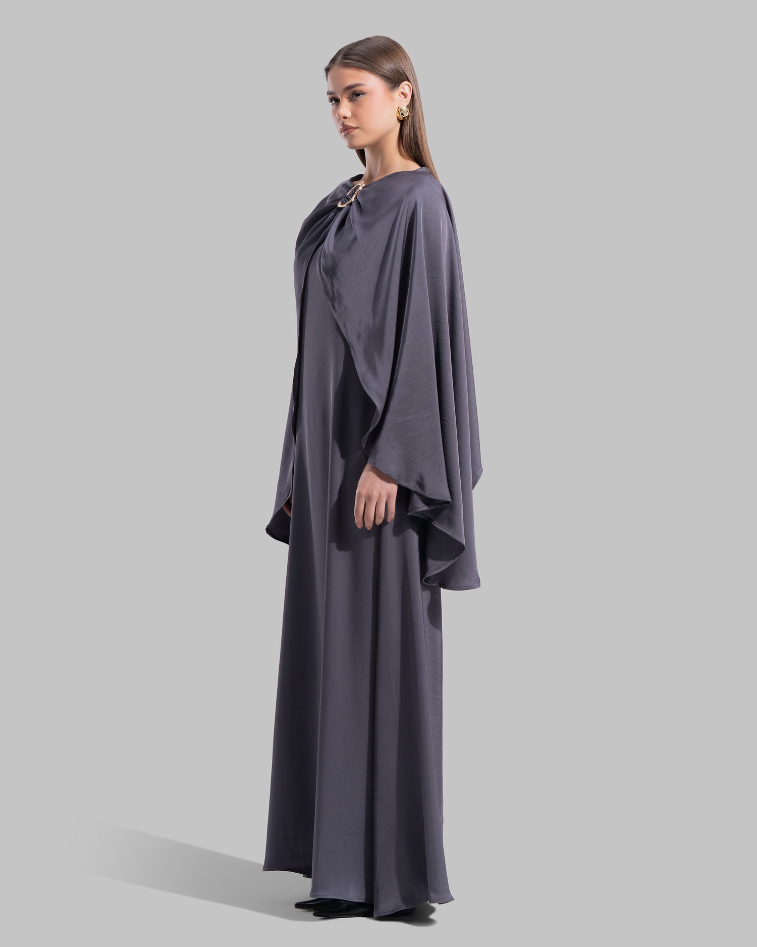 Long dress made of a flowing satin-finish fabric.