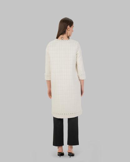 Long, off white coat made of textured tweed fabric