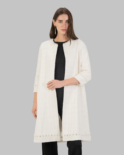 Long, off white coat made of textured tweed fabric