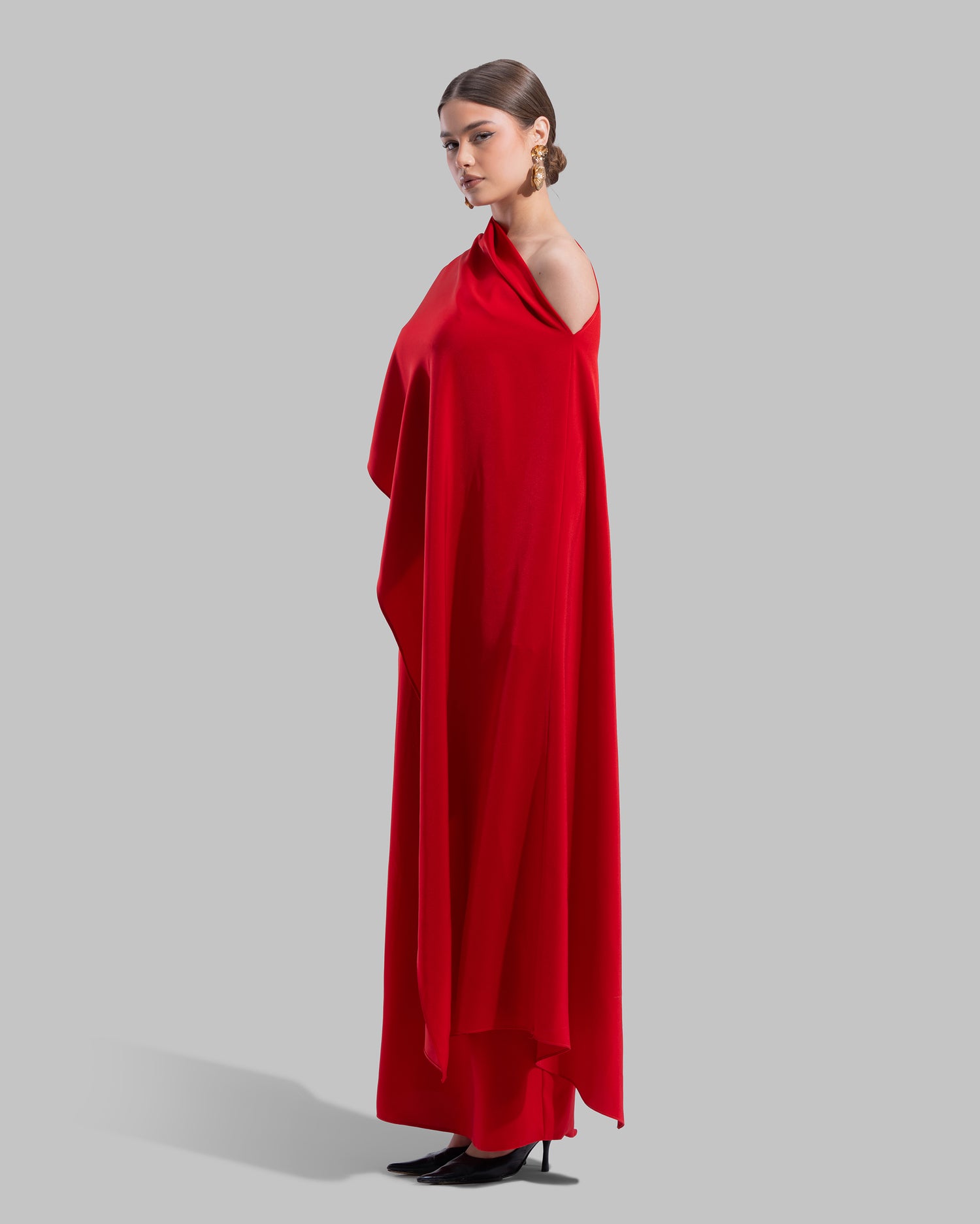 Draped asymmetrical neckline satin maxi dress with a fluid oversized silhouette.