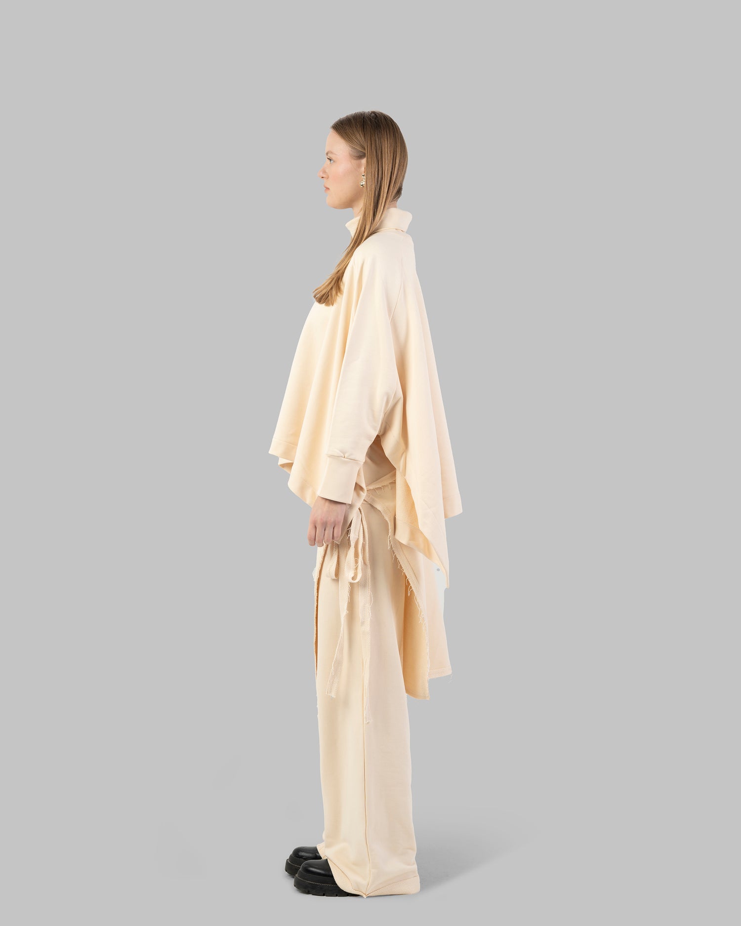 Loose-fit poncho-style top made of soft fabric.
