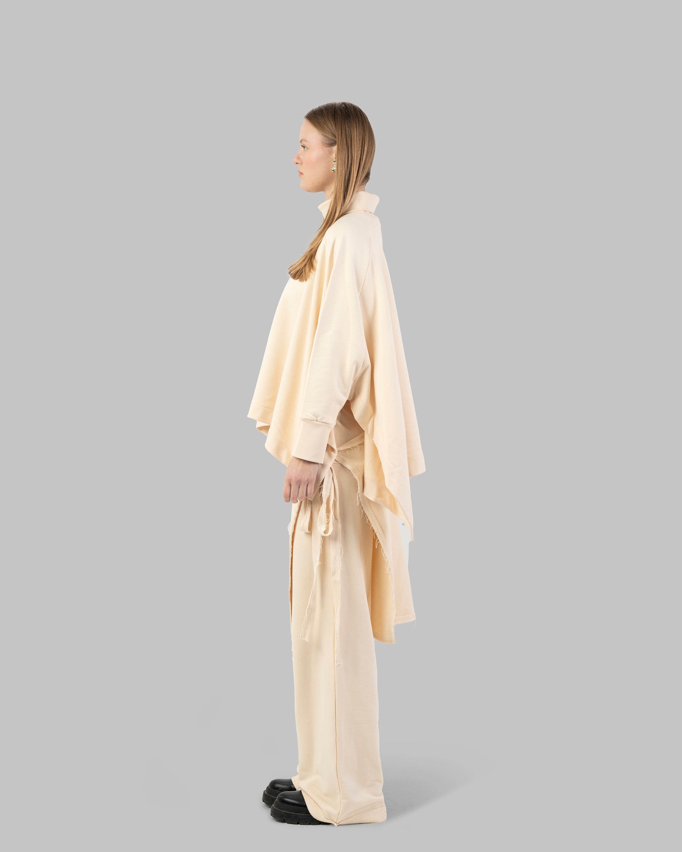Loose-fit poncho-style top made of soft fabric.