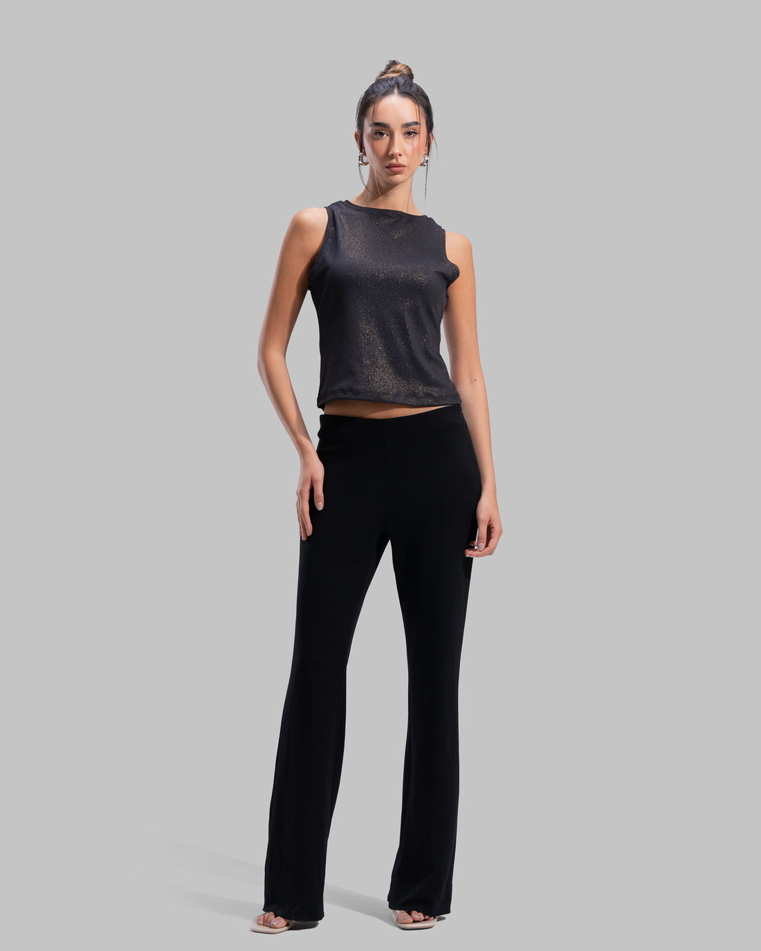 Sleeveless ribbed tank top with a metallic thread finish and a round neck.